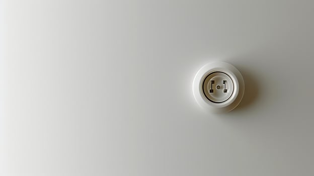 Modern white electrical socket on a minimalistic gray background. Energy connection. Concept of electricity, minimalism, home installation, utility photo