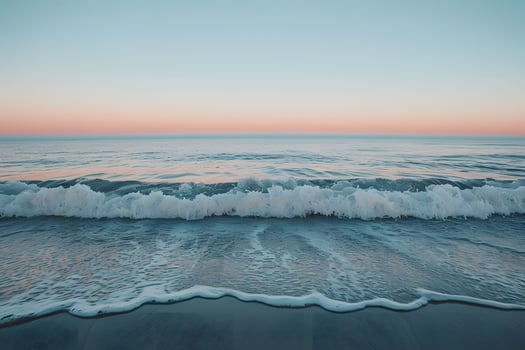 Beach wave approaching shore photo