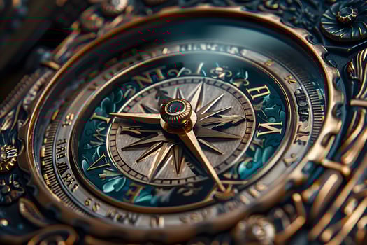 A metal clock with a compass close up photo