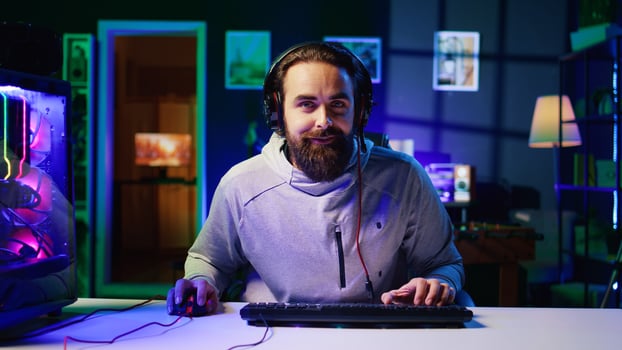 Gamer playing with teammates in esports tournament, celebrating after defeating all opponents. Happy player satisfied after winning match in multiplayer videogame while competing with friends photo