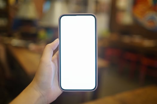 Close up of women's hands holding cell telephone blank copy space screen. smart phone with technology concept. photo