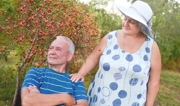 Happy senior couple enjoying each other in the park. Support and care from a loved one. love concept photo