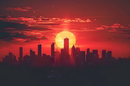 City skyline with a vibrant red sun setting photo