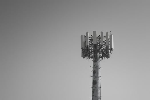 Cell tower with multiple antennas on top photo