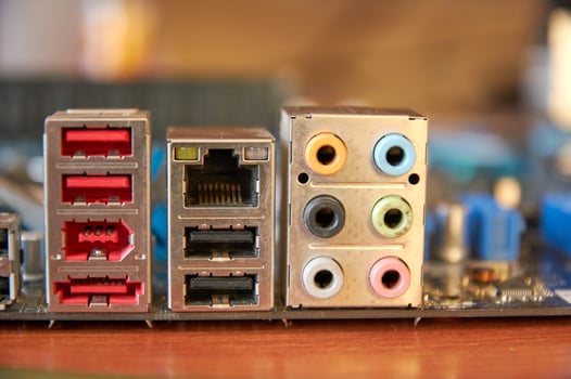 Close-up interface panel, 6 8-channel audio connectors, USB ports, LAN port photo