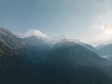 clouds over the mountains, mountains in the fog, during annapurna base camp, ghandruk, nepal photo