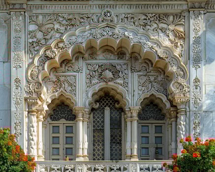 Detailed carvings on mosques entrance close-up photo