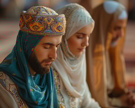 Man and woman praying together in a mosque medium shot photo