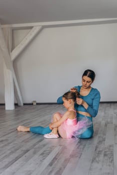 Baby ballet studio. Little ballerina with a coach in dance class. Ballet trainer for children photo
