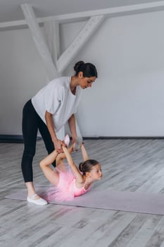 Baby ballet studio. Little ballerina with a coach in dance class. Ballet trainer for children photo