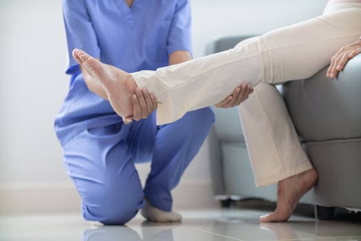 female doctor is helping a patient move her muscles after recuperating from a muscle injury and wanting to rehabilitate her to be able to use her normal daily life with continuous physical therapy. photo