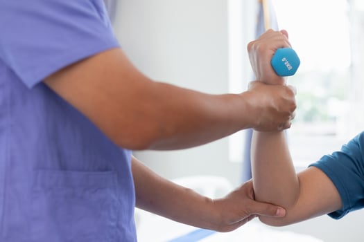 doctor is helping a patient move her muscles after recuperating from a muscle injury and wanting to rehabilitate her to be able to use her normal daily life with continuous physical therapy. photo