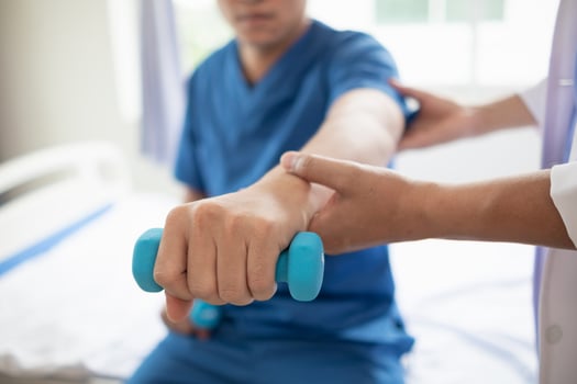 doctor is helping a patient move her muscles after recuperating from a muscle injury and wanting to rehabilitate her to be able to use her normal daily life with continuous physical therapy. photo
