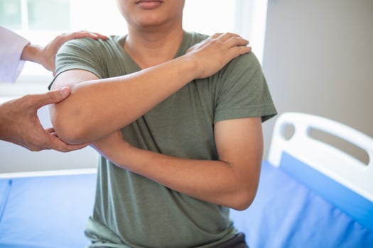 doctor is helping a patient move her muscles after recuperating from a muscle injury and wanting to rehabilitate her to be able to use her normal daily life with continuous physical therapy. photo