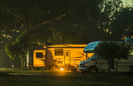 Campsite at Dusk With Two RVs photo
