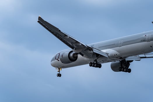 Qatar airways registration flying on cloudy day, approaching landing in Tan Son Nhat Airport in Vietnam photo