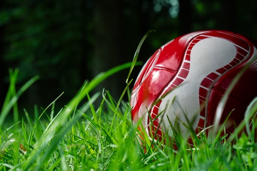 red soccer ball on the field photo