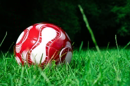 red soccer ball on the field photo