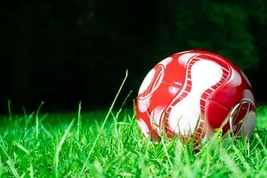 red soccer ball on the field photo