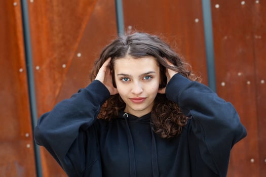 White teenager with curly hair and the most beautiful natural lips. Young girl face. photo