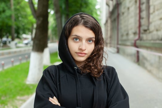 White teenager with curly hair and the most beautiful natural lips. Young girl face. photo