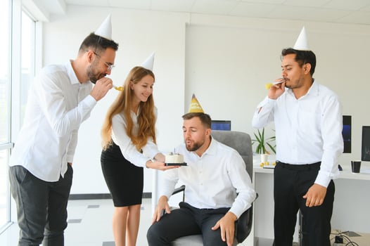 business team celebrating a birthday in the office. photo