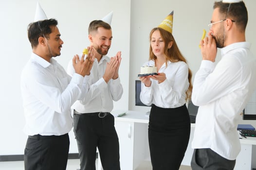 corporate party and people concept - happy team with cake celebrating colleague birthday at office photo