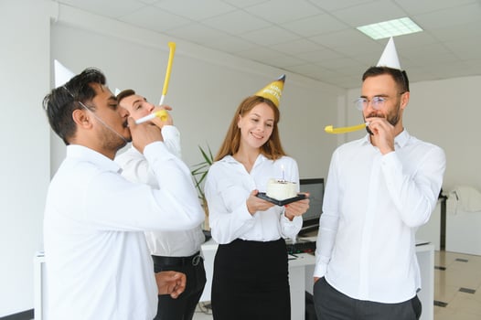 corporate party and people concept - happy team with cake celebrating colleague birthday at office photo