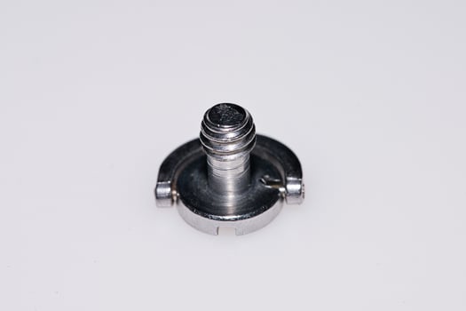 a screw on a white surface photo