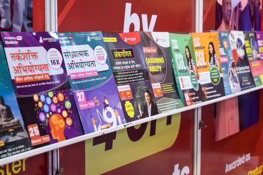 New Delhi, India, May 17 2024 - Variety of Books on shelf inside a book-stall at Delhi International Book Fair, Selection of books on display in Annual Book Fair at Bharat Mandapam complex photo