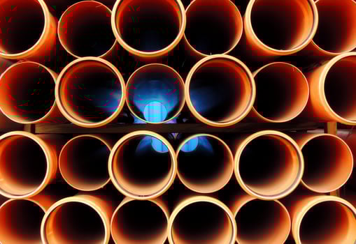 Plastic Water Pipes Stacked Close Up photo