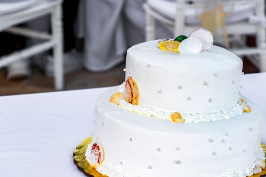 White wedding cake decorated with shells Playa del Carmen Mexico. photo