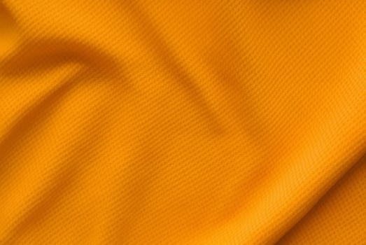 Top View Shot of Textured Orange Football Jersey Fabric photo