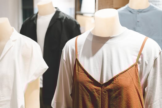 mannequin dressed in casual clothes. shelf display in shop mall store. Store Of Shopping Center. photo