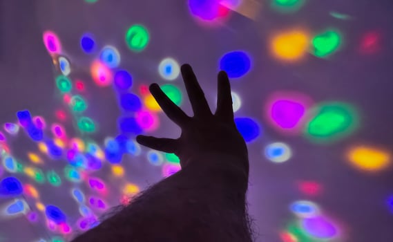 Hand gesture silhouette on a colorful background reaching out, saying hello, and show number represent photo