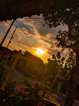 Beautiful sunset in Asia with electric cable poles photo