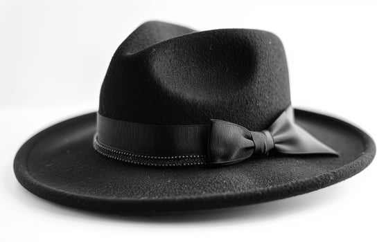 Black hat with bow on white background photo