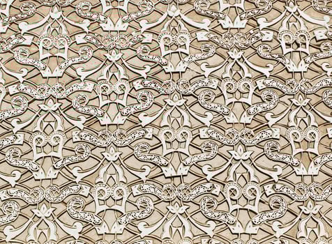 Ornate stucco work close-up. The grandeur of Moroccan craftsmanship in Marrakech. Morocco, Africa. photo