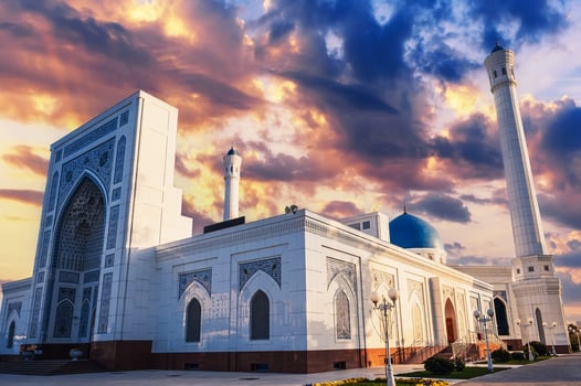 facade of modern white marble Islamic Masjid Minor Mosque in Tashkent in Uzbekistan on background of sunset sky in summer photo