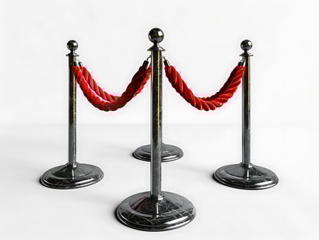 Stanchions with red velvet ropes, cut out in high resolution photo