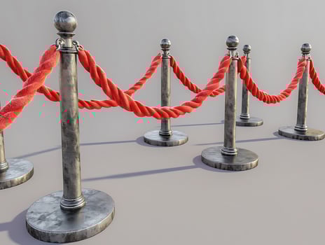 Stanchions with red velvet ropes, cut out in high resolution photo