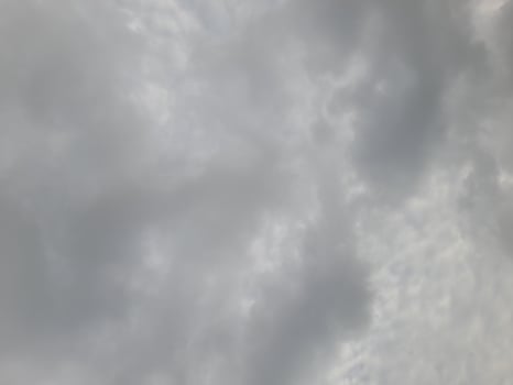 Beautiful grey clouds on sky background. Large bright soft fluffy clouds are cover the entire sky. photo