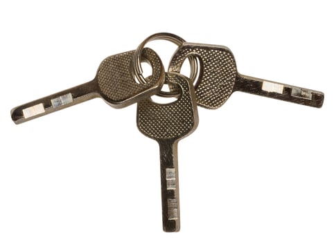 Bunch of three metal keys on isolated background photo
