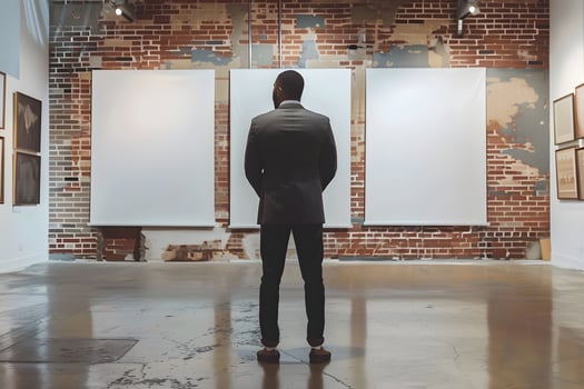 Man observing artwork in art museum photo
