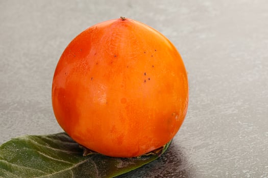 Fresh ripe sweet juicy persimmon photo