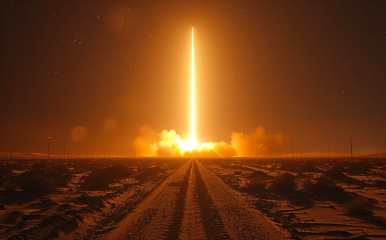 Rocket launches into the sky. A missile launch at night photo