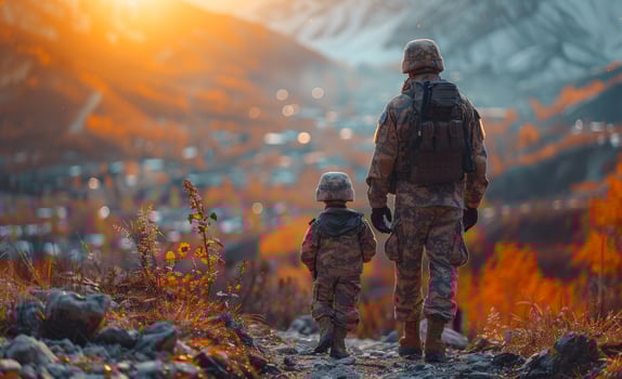 Military family walking on the mountain photo