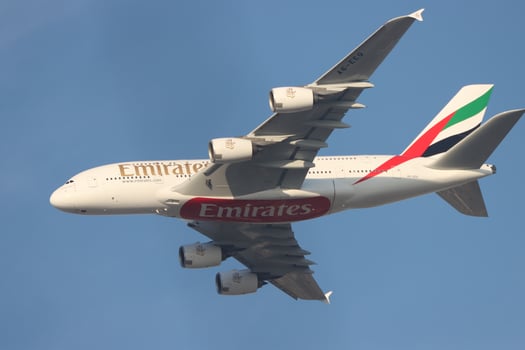 airbus a 380 , uae flying in blue sky photo