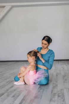 Baby ballet studio. Little ballerina with a coach in dance class. Ballet trainer for children photo