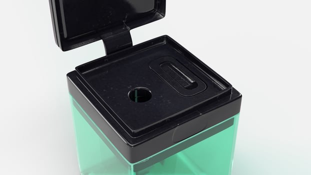 sharpener scene with green case and black plastic photo